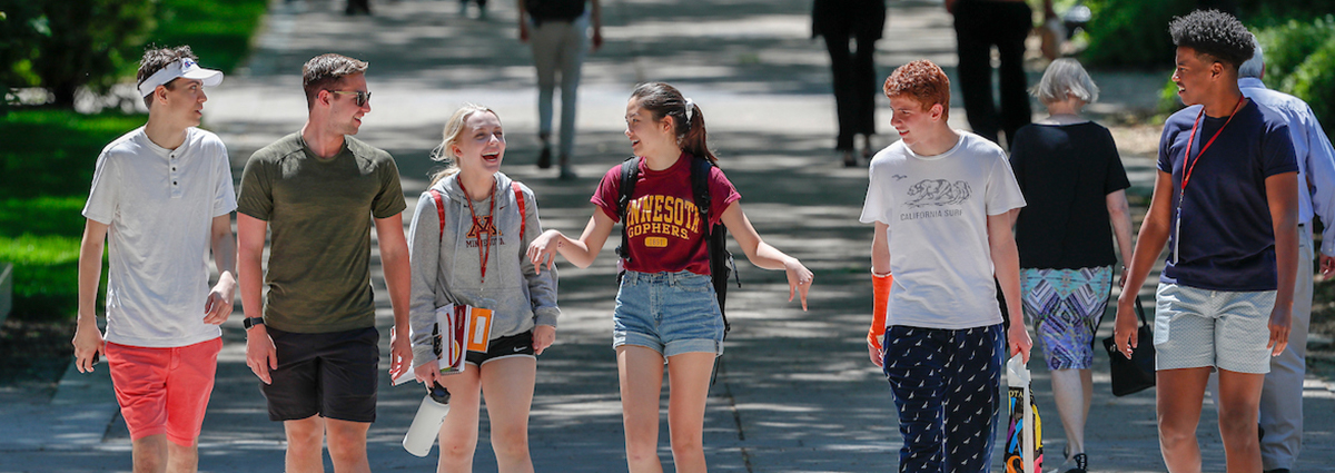 A group of students walking on campus together.