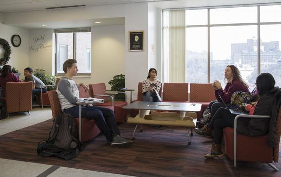 students lounging in Yudof Hall