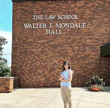 Shaghek Manjikian standing in front of Walter Mondale Hall